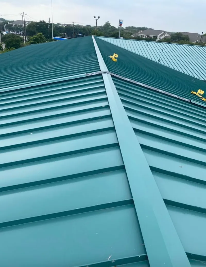 Green commercial metal roof ridge and valley for Metal Roof Repair in Fairmount